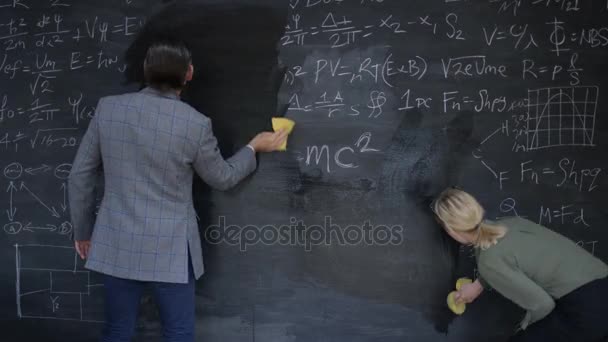 cleaning a chalkboard